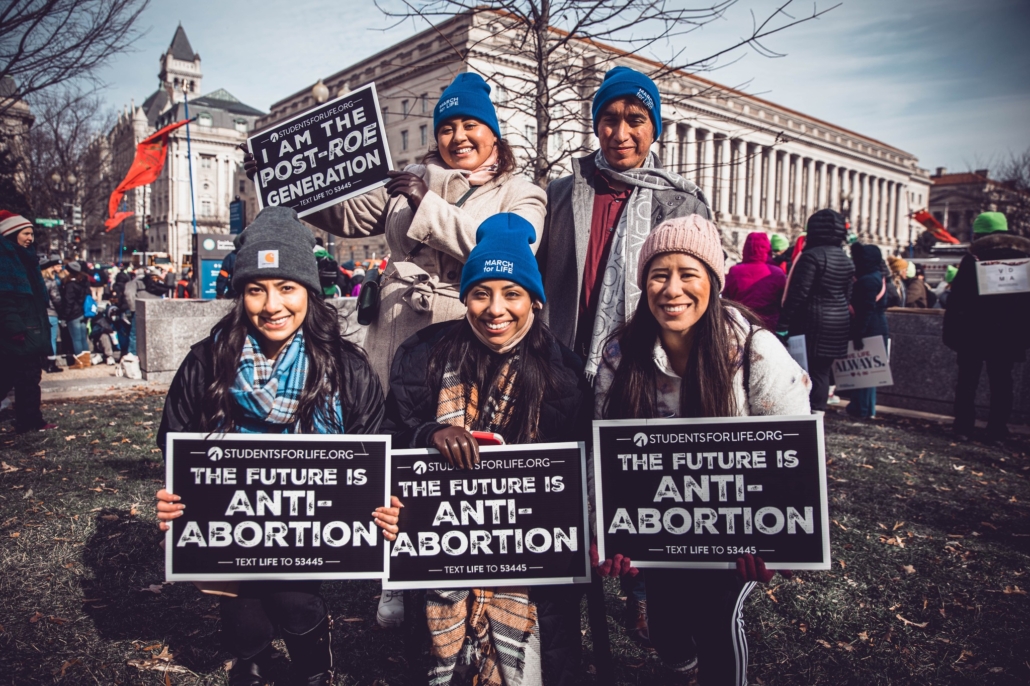 Young people with pro-life signs