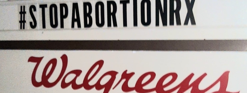 Walgreens sign that reads "Boycott us, abortion drugs kill, #stopabortionrx"