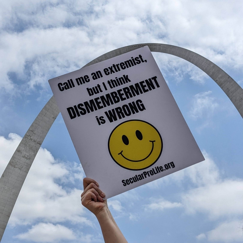 A Secular Pro-Life sign with St. Louis' Gateway Arch in the background