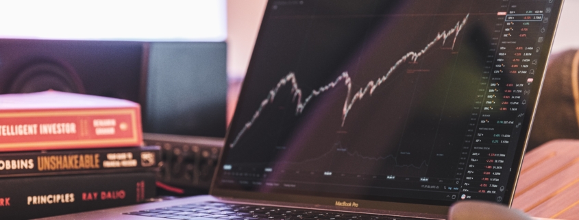Laptop displaying stock market graph