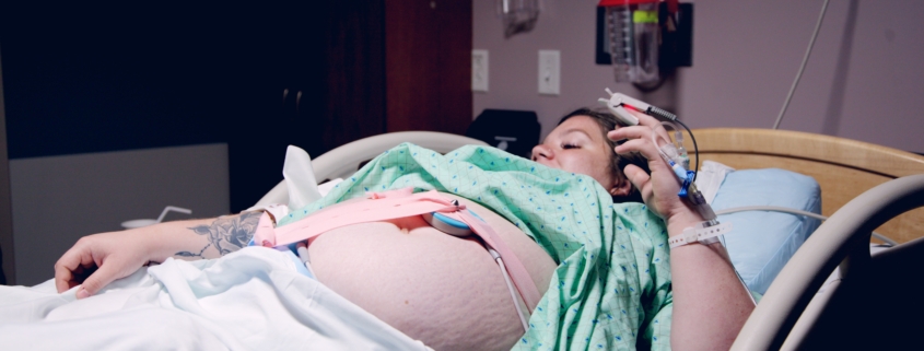Pregnant woman lying down in a hospital